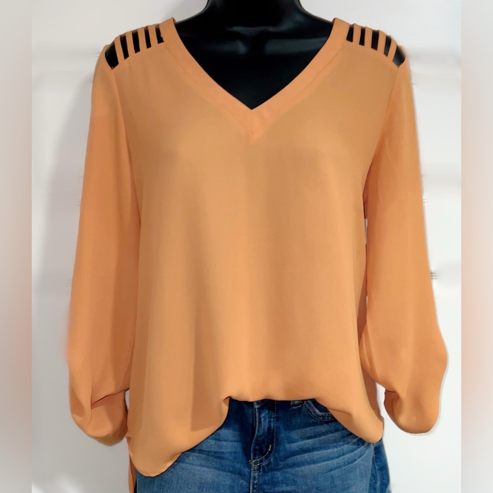 Women’s Lily White orange high low blouse with cut out sleeves.  Size M